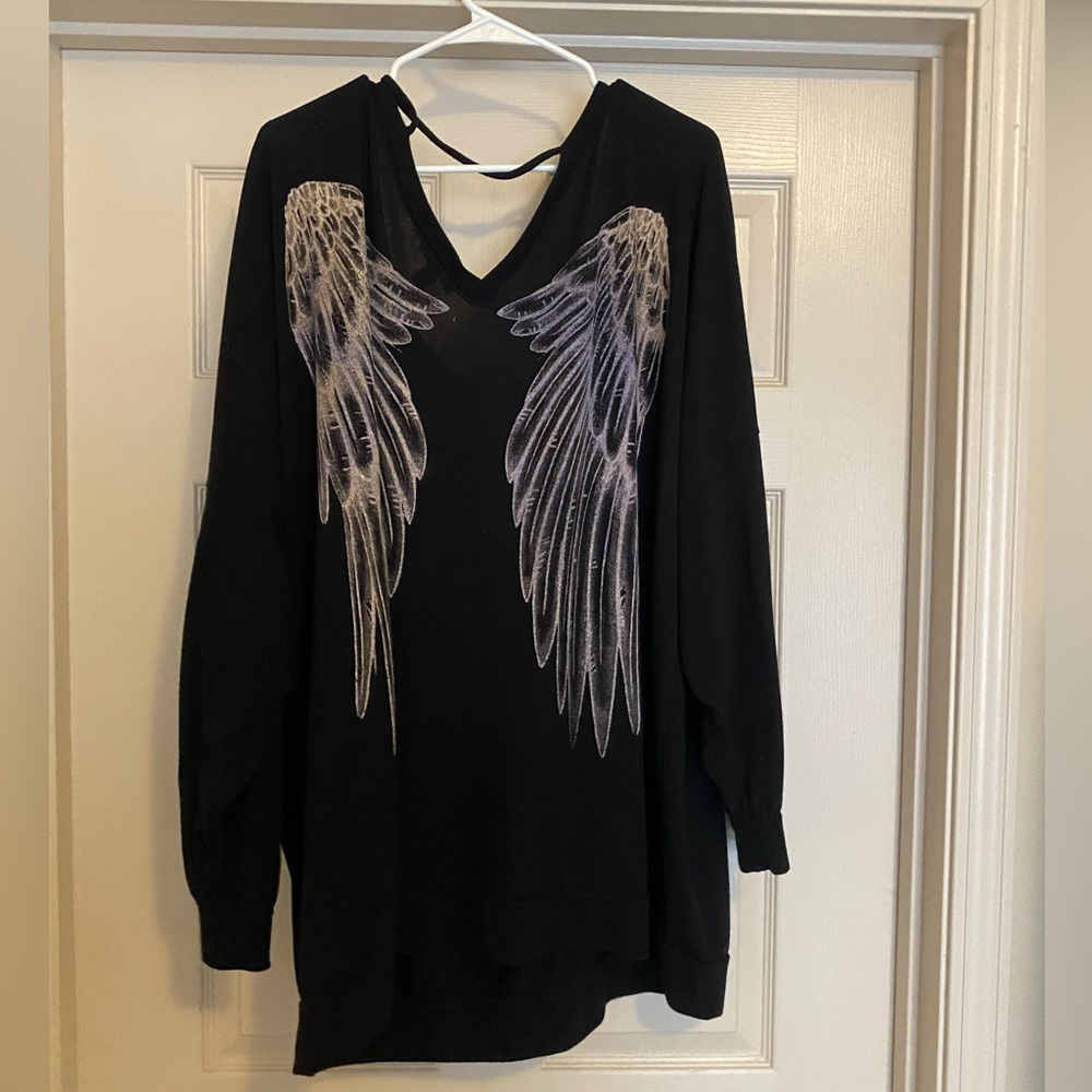 Torrid size 5 black sweatshirt with white wings on back!